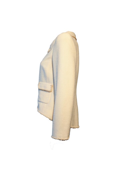 This Chanel jacket is asymmetrical designed and with gold trimmings. . Thinly padded shoulders,  cc logo button closure at front with two flap pockets.  Fully lined with 100% silk
76% wool, 11% silk & 13% nylon