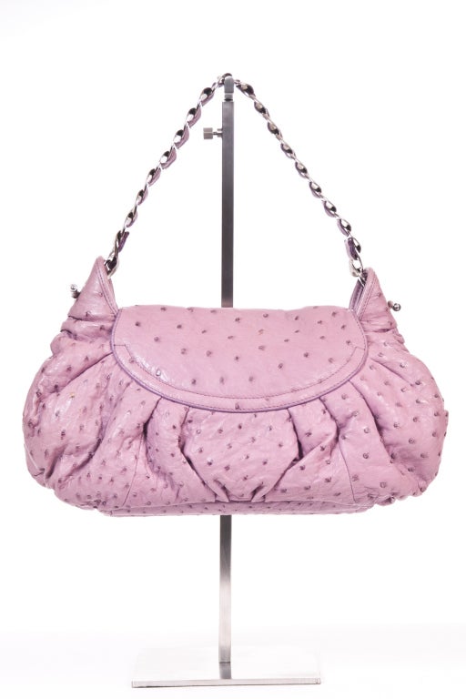 The bag is made of genuine ostrich skin and in lavender color with a very unique 