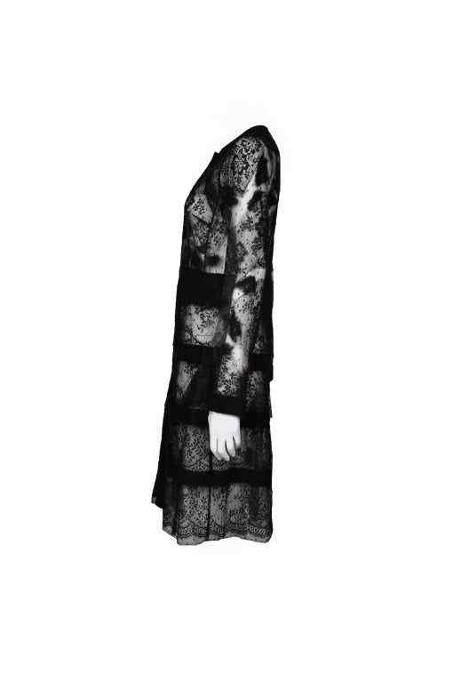 A  tiered  tulle and black lace dress coat from Valentino 2011 F/W collection.  A line style and beautifully mesh with sheer lace.  Button fastening through front.
Made in Italy. 
Material: 100% nylon