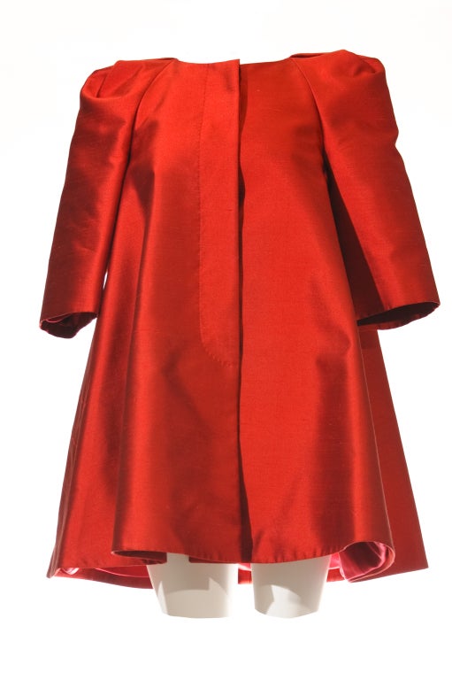 Item name: Alexander Mcqueen (2010) Fall Winter Opera Coat Item code: Description: An Imposing and Regal Red opera coat in glorious red satin! The details of the slightly exaggerated shoulder help to define it as an Alexander Mcqueen’s design. It is