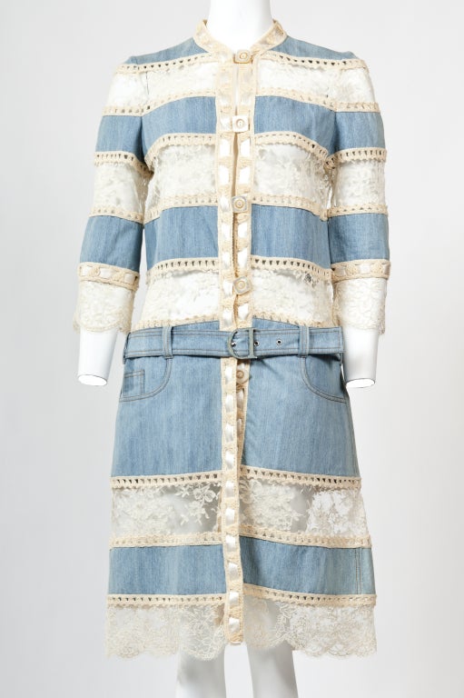 This Christian Dior dress is crocheted with denim, lace  in panels.  Loop and button fastening through front with a detachable belt.  It features with two slit pockets at skirt and two open pockets at back.