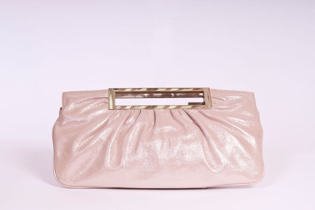 This Fendi metallic nude leather clutch is very versatile.  Zip pulling closure with two gold tone hardware handles.  Satin lining with one open interior pocket.