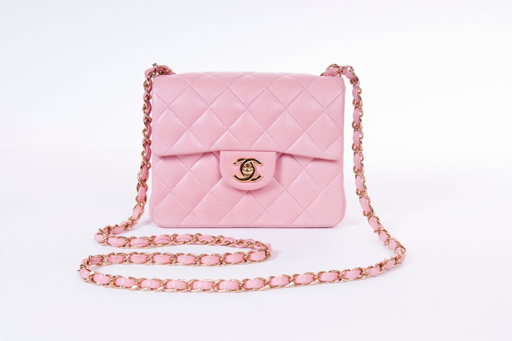 A Chanel classic mini flap lambskin leather bag in beautiful powder pink. Gold tone hardware.  CC logo turnlock.  One zipped interior pocket and one open back pocket.  Made in France.  It comes with a dust bag and authenticity card.
Strap: drop