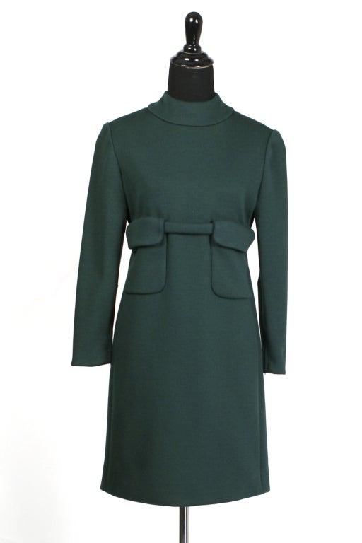 A mint Donald Brooks mod dress in hunter green wool. Oversized pockets with belt that wraps around to the back. Medium weight wool.  Excellent condition.

Store Location:

DEVORADO
436 E.9th St.
NYC, NY 10009
Store Hours: Mon-Sat 12-7pm, Sun