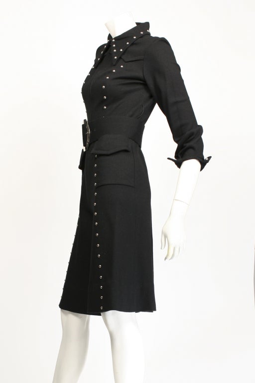 1970's Marion Digney black jumpsuit with stud details. Zippered front.  Cropped pants come up just above the knee. Medium weight wool. Excellent Condition.

Marion Digney was a fashion designer in the 60's and 70's and had a shop on 7th Ave in