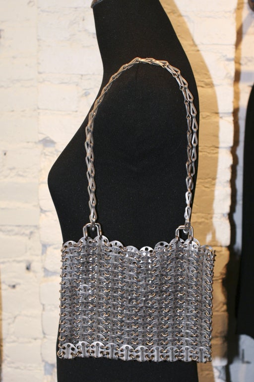 Original Paco Rabanne 1969 Bag.
Silver metal chainmail discs.

Le 69 was the first ‘It’ bag and a symbol of the swinging 60s, created in 1969 to match Rabanne's metallic mini dresses.
The iconic bag, famously owned by Brigitte Bardot and