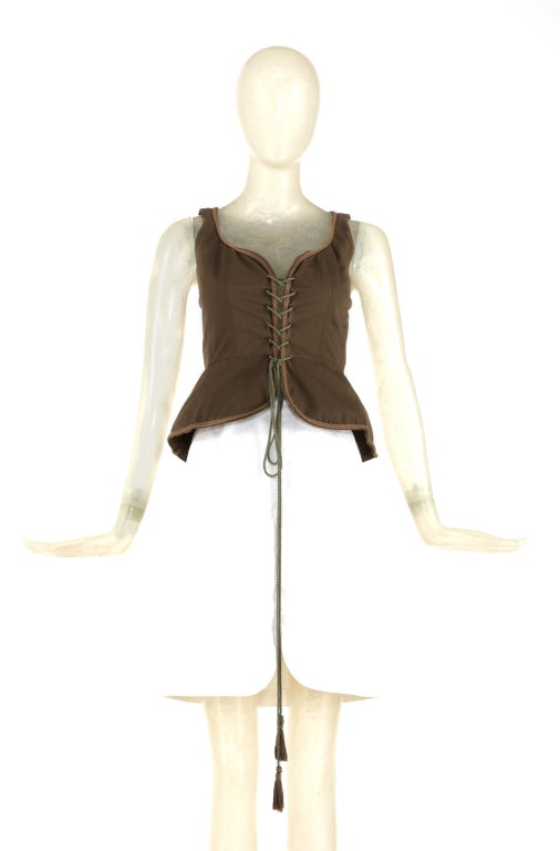 Iconic YSL Corset Top. A gorgeous safari green color with corset details in front. A tassel is at the end of the tie cord. A true collectors piece.

Store Location:

DEVORADO
436 E.9th St.
NYC, NY 10009
Store Hours: Mon-Sat 12-7pm, Sun 1-7pm