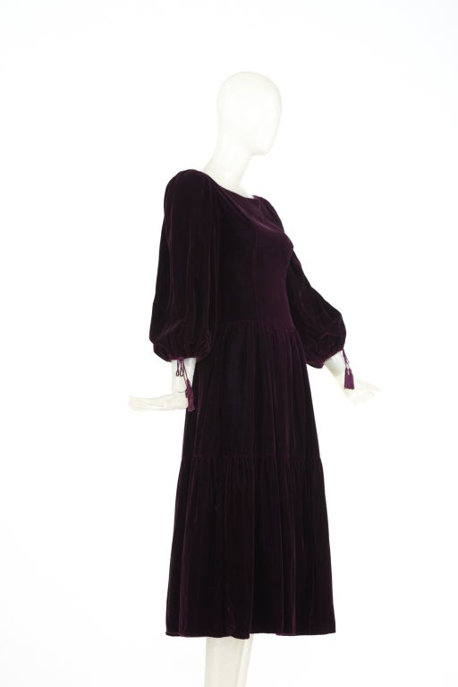 OSCAR DE LA RENTA 1970s Purple Tassel Peasant Dress. Gorgeous deep purple velvet with blouson sleeves that can be worn up or down. Tassels adorn the sleeves. Excellent condition.

Store Location:

DEVORADO
436 E.9th St.
NYC, NY 10009
Store