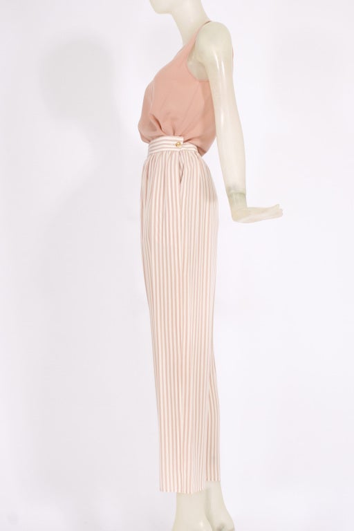 CHANEL dating to the 1980s but in new condition with CREEDS store tags attached. Soft pink palette with stripes. Highwaisted pants and silk tank. Duster with tie. 

Boutique Location:
DEVORADO
436 E. 9th St.
NYC NY 10009

Hours: Mon-Sun 12-8pm