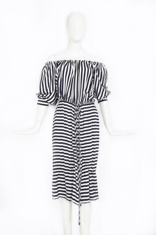 Nautical Stripe Dress by Moschino. Bergdorf Goodman tags attached.

Gathered elasticized neckline is adjustable and can be worn off the shoulder. 
The vertical stripe top of the dress is contrasted by the horizontal stripes of the skirt. 
Two