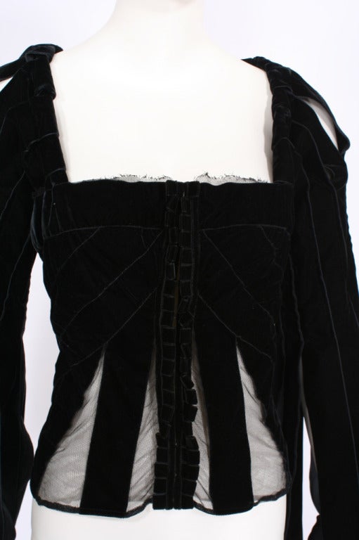 Yves Saint Laurent from the Tom Ford Era. This 100% silk velvet ribbon and mesh corset top is an Iconic piece from the Fall/Winter 2002. Back can be tightened with straps.
Excellent collection. French sz.42 Fits (Small to Medium).

Store