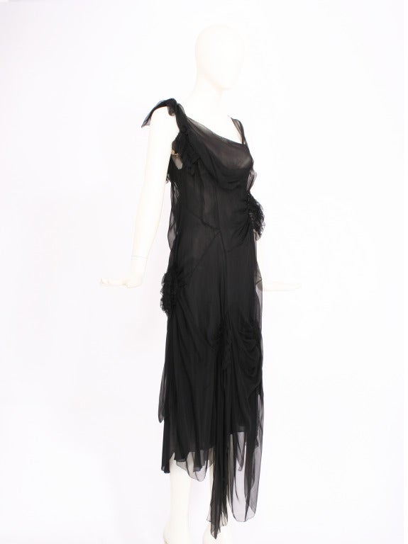 Alberta Ferretti black chiffon dress with ruches gathered bundles throughout. Slip underneath the dress provides coverage and is also silk chiffon. 
asymmetrical hem. Excellent condition.

Store Location:

DEVORADO
436 E.9th St.
NYC, NY