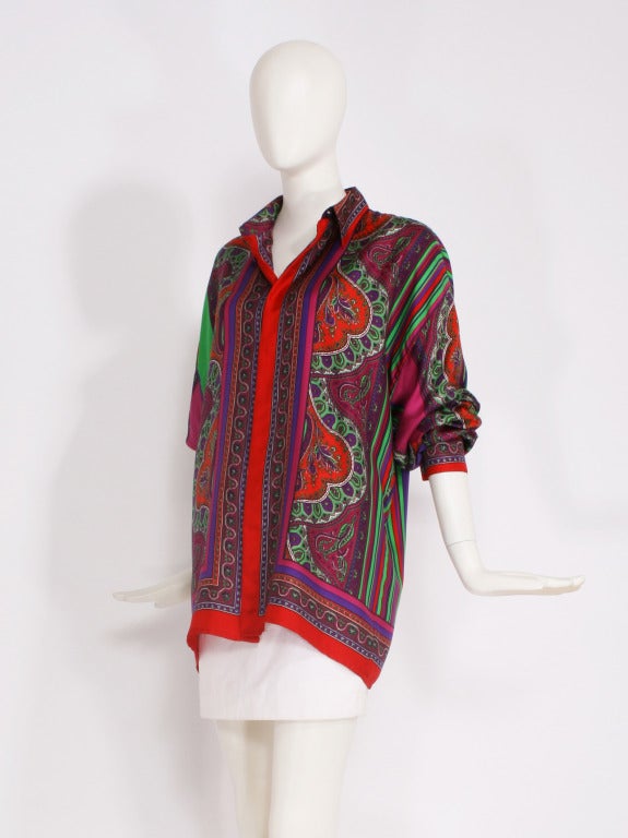 Gianni Versace Istante silk blouse. Istante was Versace's younger line started in the 1980's. This blouse has long sleeves and is button up. A gorgeous print of paisley and stripes with vibrant colors. Mint condition.

Store