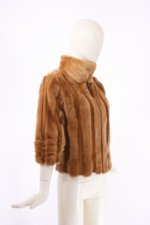 Blumarine Camel Color Rabbit Fur Jacket. Gathered bracelet sleeves. Fur is spaced with cashmere. Zip front. Suede tie at back for perfect fit. Like new condition. Fits size s-m.

Store Location:

DEVORADO
436 E.9th St.
NYC, NY 10009
Store