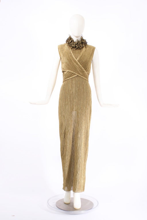 Ralph Lauren Collection Gold Gown with Wrap. The gown has an open back with option to add the wrap. Ties in the back. Ruffle collar with gold lace made from metallic thread. Feels like the dress was dipped in a pot of gold. Gown is composed of a