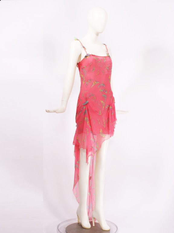 Gianni Versace Couture Pink Chiffon Butterfly Dress dating from the 1990s. An extremely feminine dress. Accented with crystals and multi-color butterflies. A hot pink, sheer, silk chiffon fabric. Spagetti straps and elegant drapping. Asymmetrical