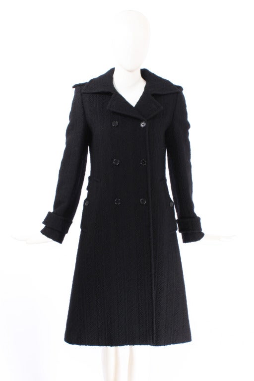 Dolce and Gabbana Black Textured Wool Coat. Collar can be worn up or down. Epaulets. Double breasted.Waist band at back. Vent in back. Excellent condition.

Store Location:

DEVORADO
436 E.9th St.
NYC, NY 10009
Store Hours: Mon-Sat 12-7pm,