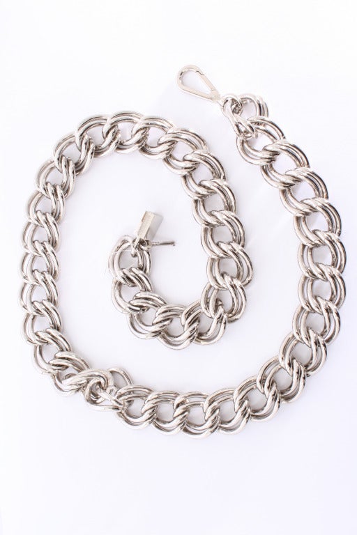 Moschino Chain Link Belt. Silver tone with thick chain links. Moschino inscribed in lock. New Condition.

Store Location:

DEVORADO
436 E.9th St.
NYC, NY 10009
Store Hours: Mon-Sat 12-7pm, Sun 1-7pm