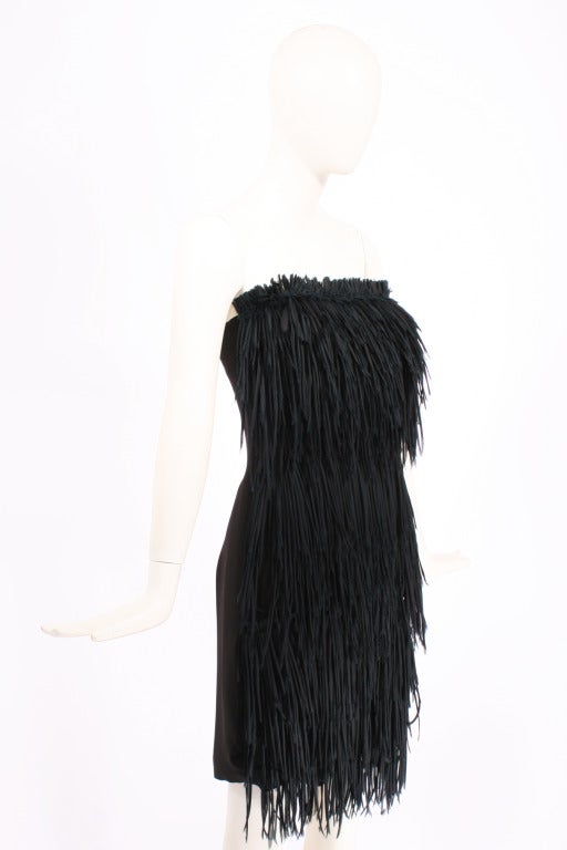 Brioni Black Fringe Dress.

Mini dress with long fringe made of silk and chiffon rolls. Very edgy and sexy.  Side zip. Fringe in only in the front- back is smooth.
Excellent condition

Store Location:

DEVORADO
436 E.9th St.
NYC, NY