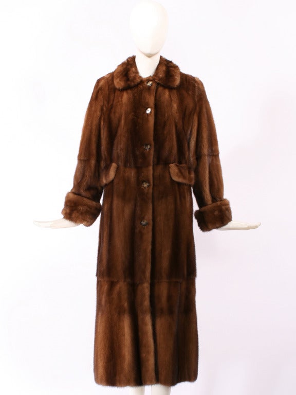 J. Mendel Full Length Mink Coat in perfect condition. Lovely chocolate tones. Cuffs at wrist can be lowered or widened. A perfect winter piece.

Store Location:

DEVORADO
436 E.9th St.
NYC, NY 10009
Store Hours: Mon-Sat 12-7pm, Sun 1-7pm