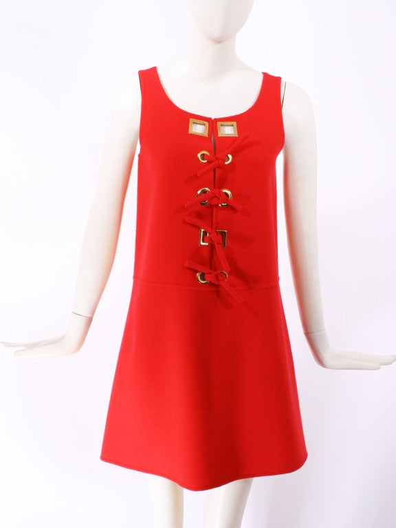 Laura Biagiotti Red Mod Dress. Beautiful brilliant red wool fabric with gold tone square accents at the collar. Large space age style grommets. Excellent Condition.

Store Location:

DEVORADO
436 E.9th St.
NYC, NY 10009
Store Hours: Mon-Sat