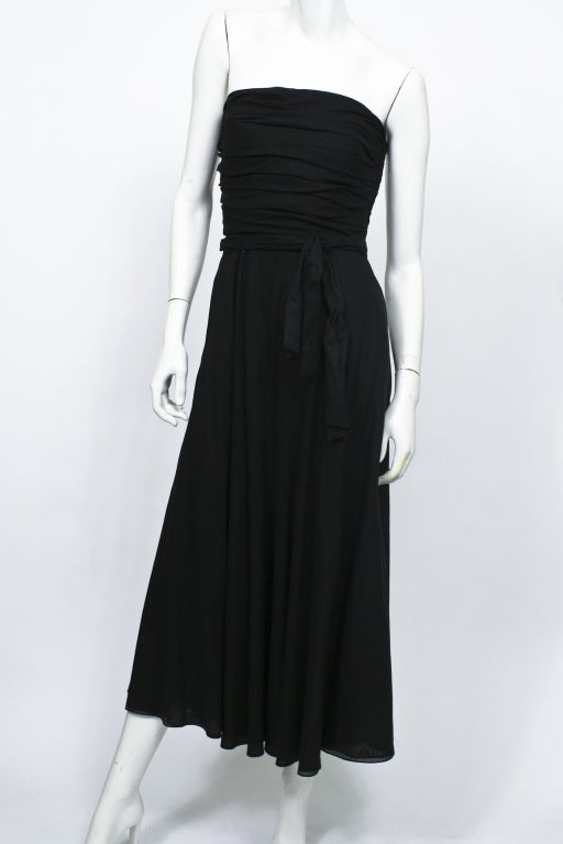 1980's Ralph Lauren black strapless dress. Ties at waist. Gathered bodice. Calf length. Excellent condition.

STORE LOCATION
Devorado
436 E.9th ST
NYC, NY 10009

Monday-Sunday 12-8pm