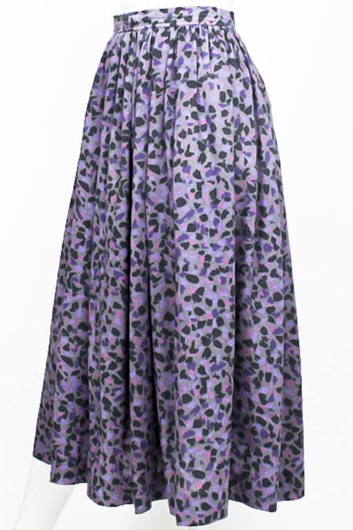 1970's Yves Saint Laurent high-waisted skirt. Violet, lilac, magenta, teal, and grey floral print. Buttons and zips at back. Calf-length. Excellent Condition.

STORE LOCATION
Devorado
436 E.9th ST
NYC, NY 10009

Monday-Sunday 12-8pm