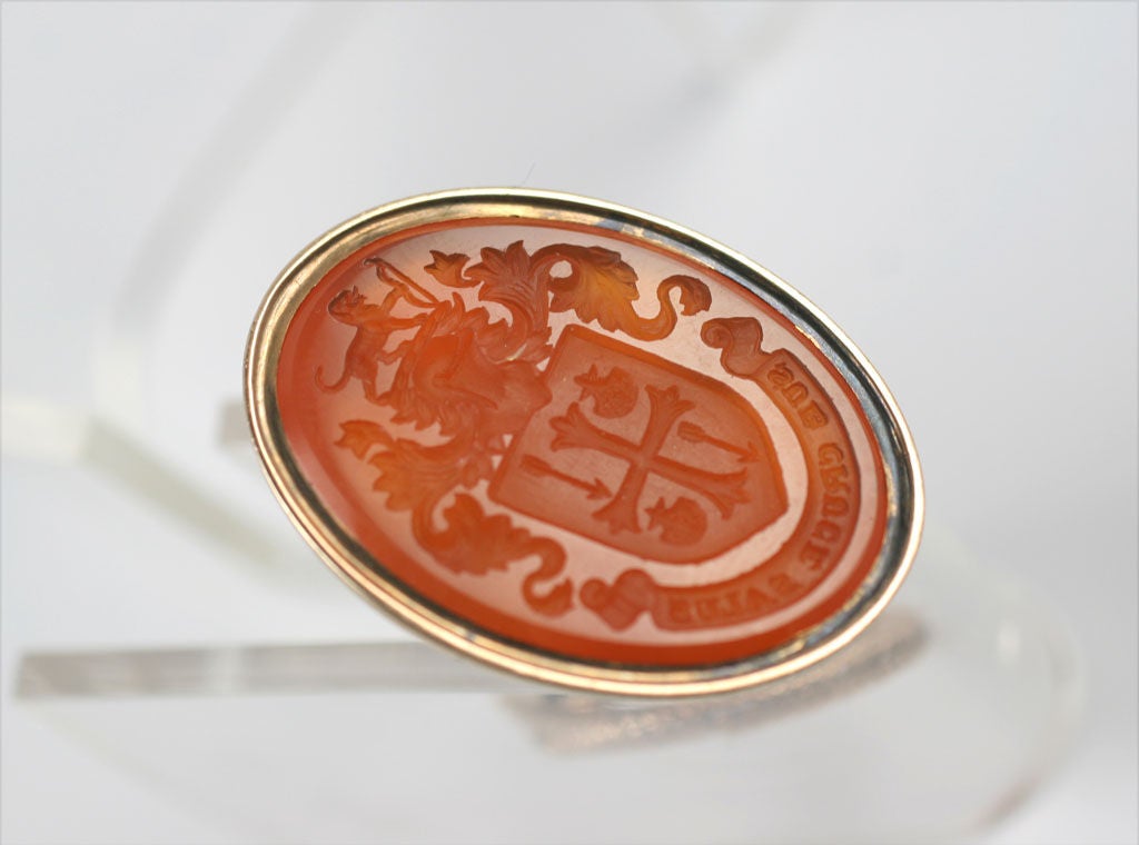 We offer an early 19th century hard stone seal that once identified a family or an individual. The carnelian is inscribed with a crest that has been divided into four sections by a cross.Two sections show arrows pointing south.The other <br />
two