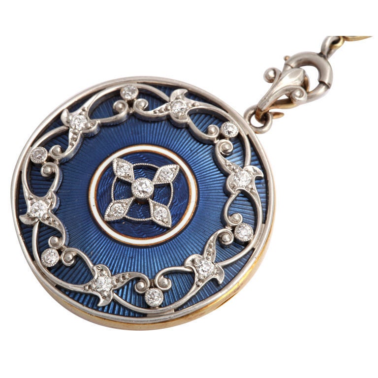 Rich blue, the color of a clear, late night sky sets the background for diamonds on this utterly, perfect necklace and locket . Henry Blank and Co. the American Newark jeweler responsible for this necklace is known for incorporating the best quality