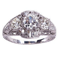 Vintage Breathtaking Detail in a Three Diamond Platinum Ring