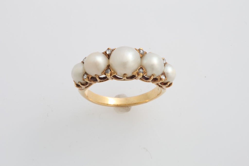With an appearance that is soft as a cloud, nature formed these pearls without a helping hand and prior to the turn of the century when the reknown Mikkimoto fashioned cultured pearls. The pearls are full rounds of warm irridescent color that flash
