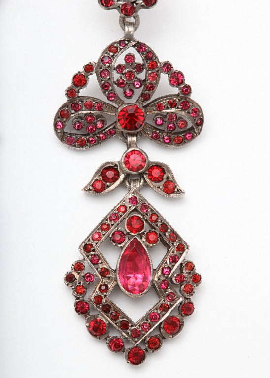 Superb quality earrings designed with the flourish of garlands, have been made of foiled pastes in the manner of Georgian and Victorian earrings. From the tiny pastes to the large teardrops, all stones were cut and polished then set like gemstones.