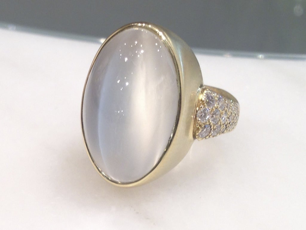 One-of-a-Kind Oval Platinum Moonstone (21.05cts) Ring set in 18.5k yellow gold with pave' diamonds (.88 ct). Size 7.25 (Can be sized). Stamped 18k/SS