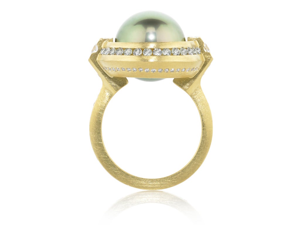 One-of-a-Kind Spinning Galaxy Ring in 18k yellow gold with a rotating 12.5mm Tahitian pistachio pearl, sapphires (0.52ct) and diamonds (0.51ct). Size 6.75 (can be sized).