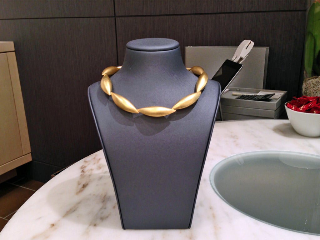 Cocoon Collar in 18k yellow gold with ten pods.
