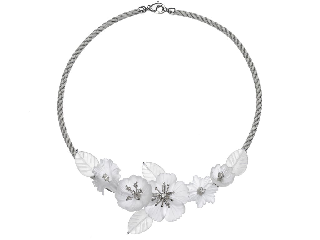 Intricate necklace handcrafted by renowned jewelry artist Russell Trusso featuring five hand-cut frosted rock crystal elements adorned with both round and marquise brilliant-cut white diamonds on a silver steel cord.
