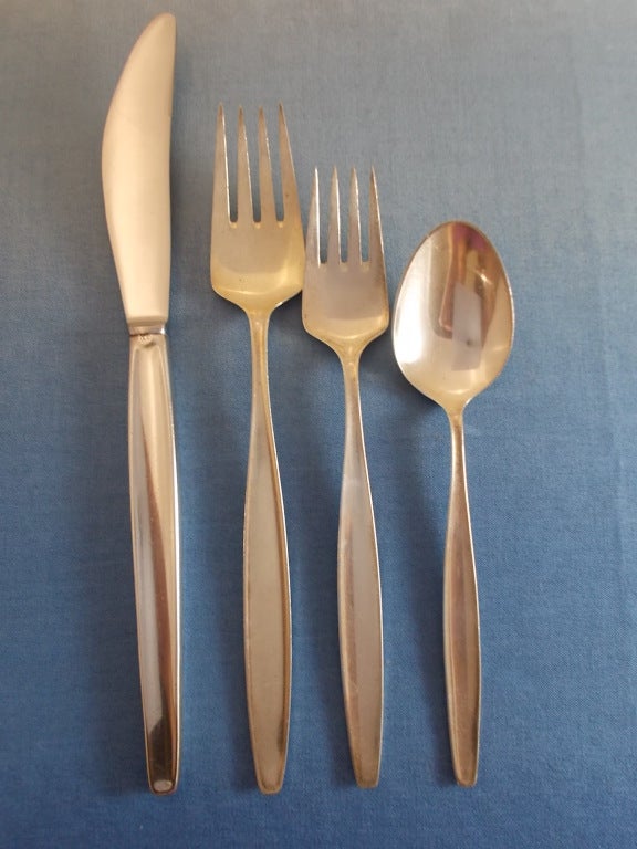 Designed by Tias Eckhoff, c1954.
This Cypress by Georg Jensen Sterling Silver 4-Piece Modernism Dinner Place Setting includes the following pieces:

1 Dinner Knife, long handle, 8 7/8