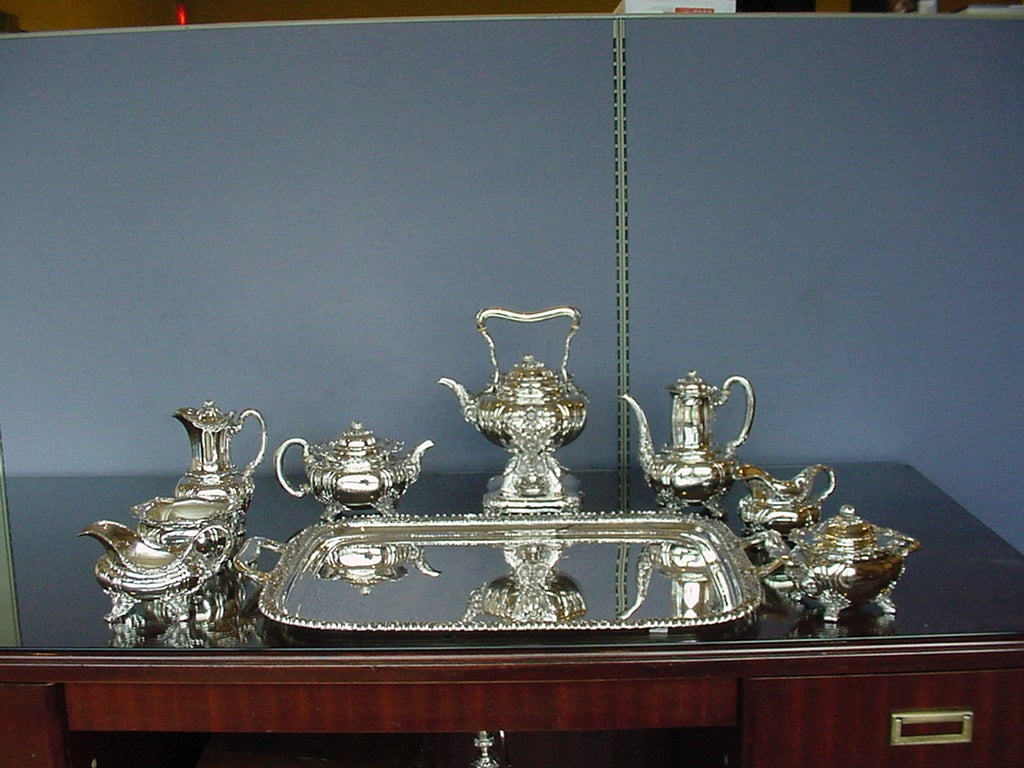 Magnificent 9pc Sterling Silver Chrysanthemum by Tiffany Tea Set. Set includes the following:
Fabulous Kettle on pierced Stand with burner, 4 1/2PT, 13 3/4