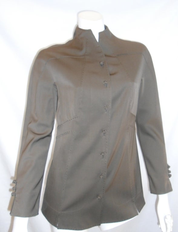 Lite wool shirt/ jacket. Signature top stitching, hand made knots front button closure. 
Size 4
Bust 36