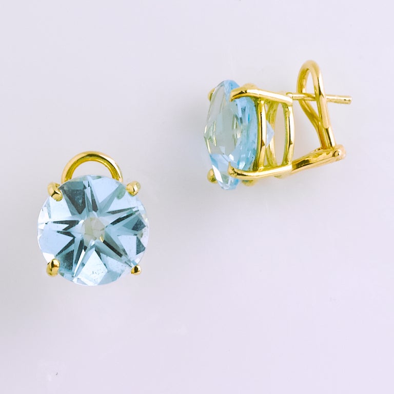 Stunning sky blue topaz stud earrings cut in a sparking star design for pierced ears.

17 carats total weight.