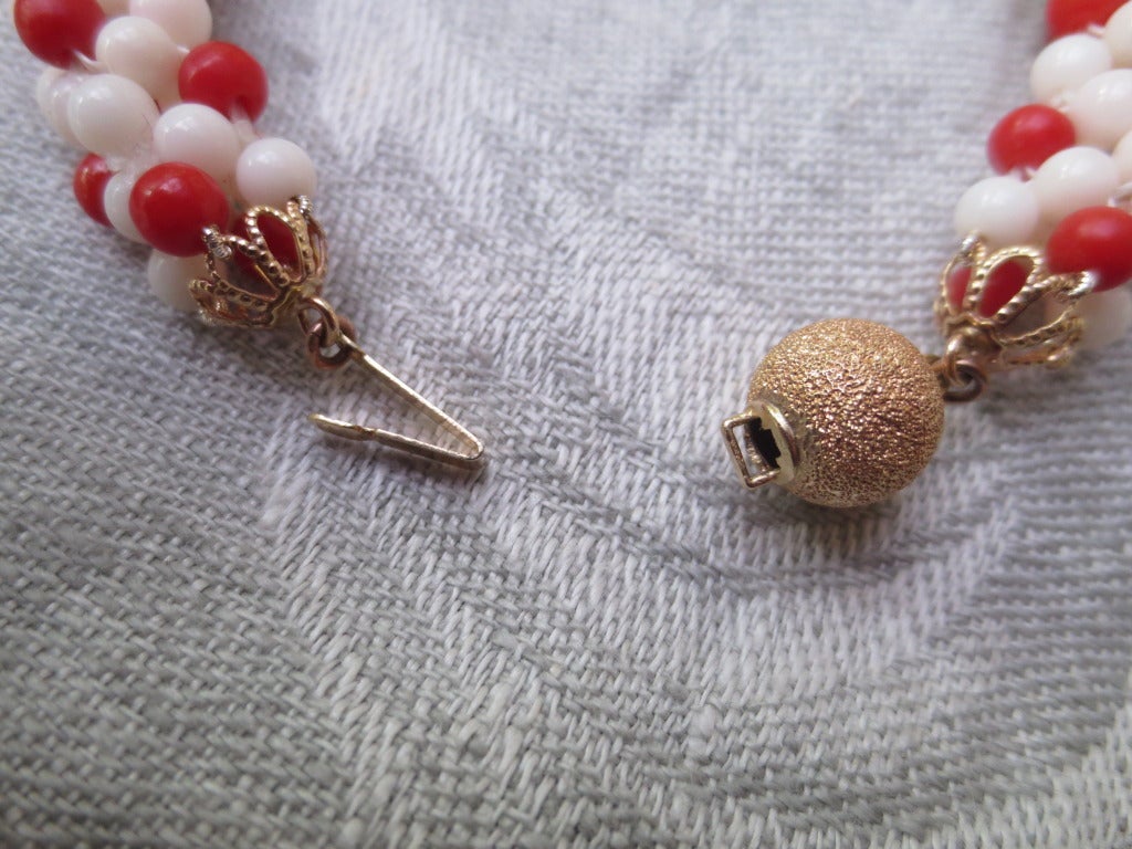 White and Red Coral Bead Woven Rope Bracelet with 14 Karat Gold Sphere Clasp In New Condition In Los Angeles, CA