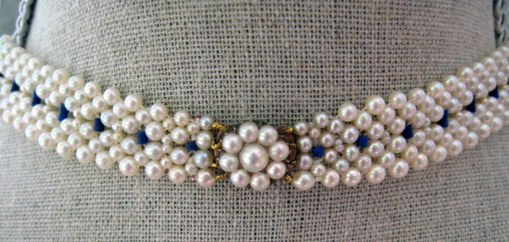 An antique blue enamel and pearl centerpiece was attached to a pearl and lapis lazuli necklace with pearl and 14k gold clasp by Marina J. to create a new necklace that both has history, but is for the modern woman. The french antique centerpiece is