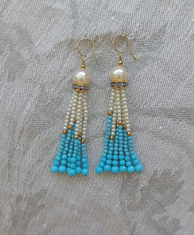 These vibrant tassel earrings feature beautiful 6mm freshwater pearls, silver, 14k yellow gold and diamond rondelles and graduated Turquoise, pearl and faceted 14k yellow gold beads.
Ear wire is 14k yellow gold.