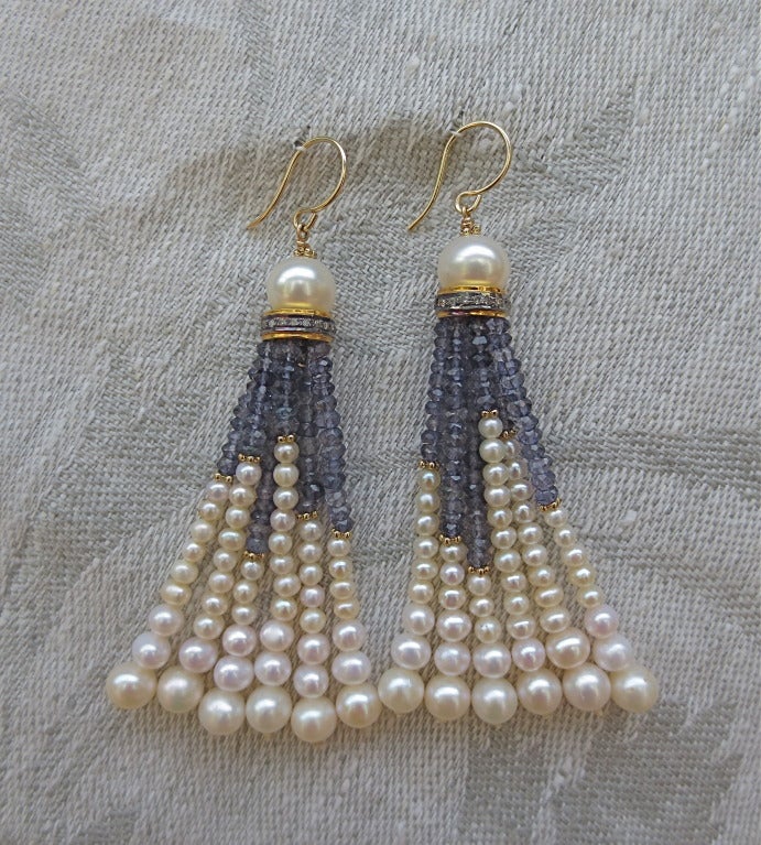 Timeless, these elegant tassel earrings feature 6mm freshwater pearls, Silver, 14k yellow Gold and Diamond rondelles finished with slightly graduated strands of pearls, faceted iolite and 14k yellow gold beads.