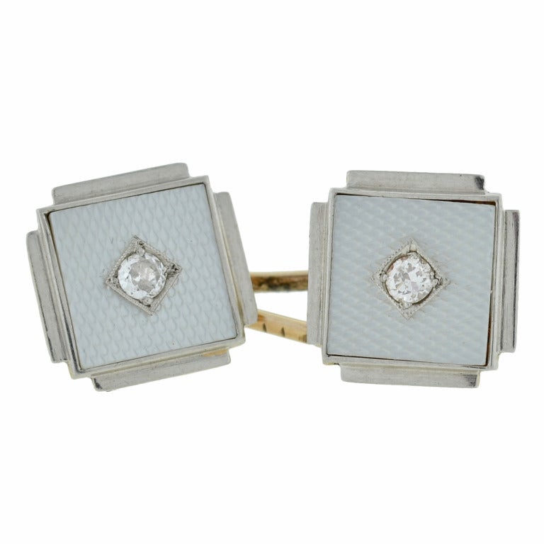 A fabulous pair of cufflinks from the Art Deco (ca1920) era! Made of platinum topped 18kt yellow gold, these cufflinks have a wonderful Deco look. Each double cufflink is square shaped with a Guilloche enamel surface in a textured pattern. In the