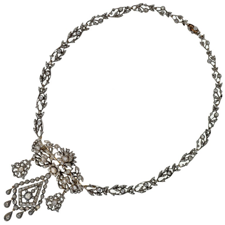 A truly exceptional French pin and necklace set from the Georgian (ca1780) era! Made of silver and old Rose Cut diamonds, this well-preserved piece is absolutely gorgeous. Much of Georgian jewelry is inspired by the beauty of nature, and this