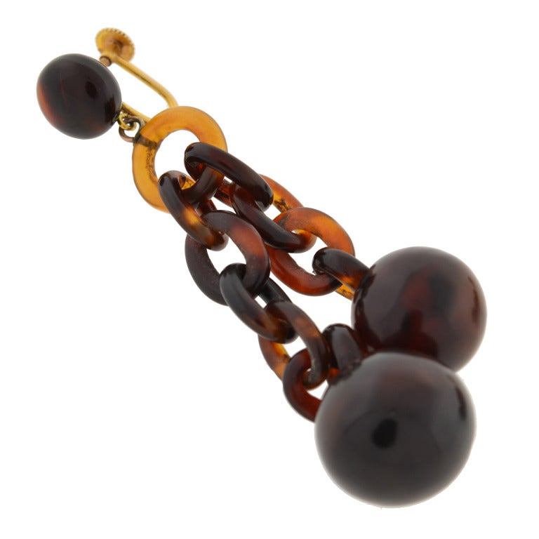 Now a banned material, Antique tortoise shell jewelry has become very collectable. These hanging ball tortoise earrings are particularly wonderful and from the Victorian (ca1880) era! Each begins with a tortoise shell bead topper, which is attached