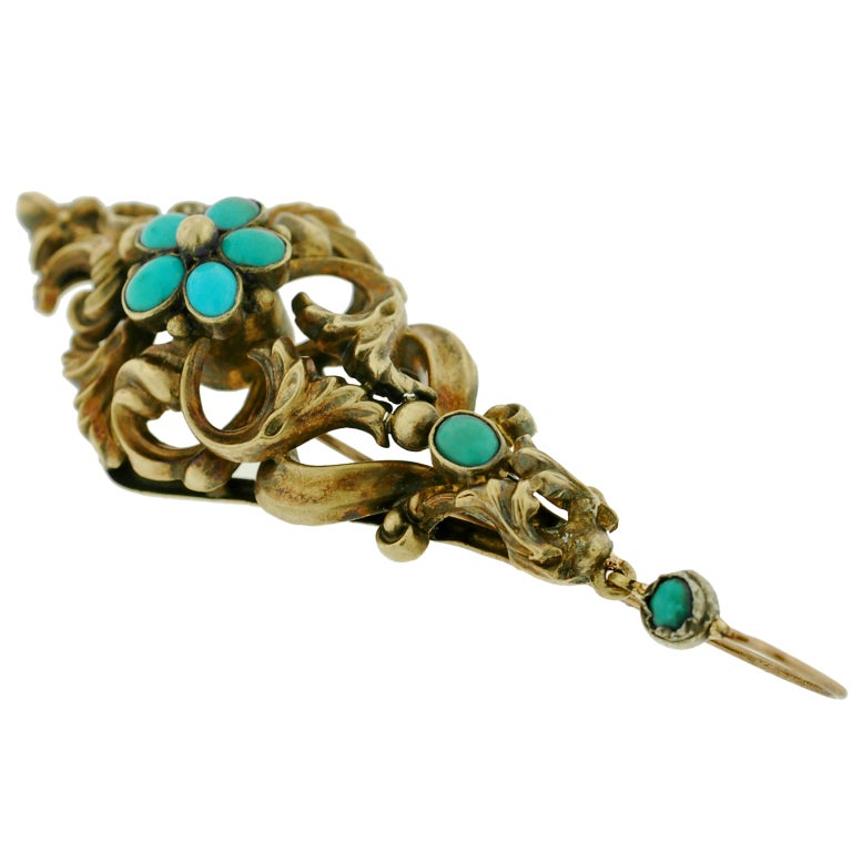 Absolutely incredible hand wrought gold and turquoise earrings from the Georgian period. These fantastic earrings are made of 18kt gold and are particularly large in size. With a magnificent and royal-looking appearance, each has a scrolled and