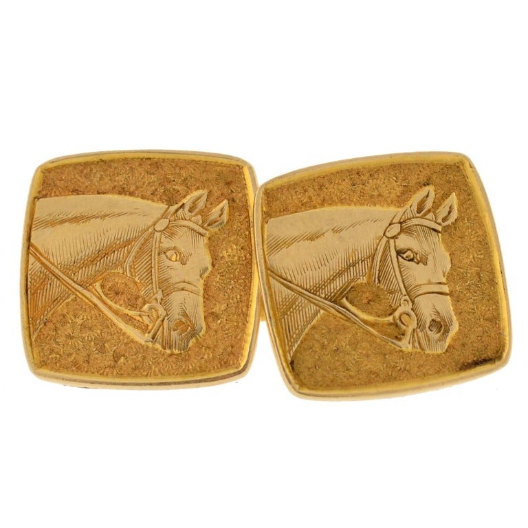 Fabulous Tiffany & Co. cufflinks from the Retro (ca1940) era! These fabulous cufflinks are made of 14kt yellow gold and each have 2 square shaped faces. The links have a very detailed image of a horse with a textured background. The square faces