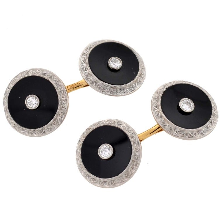Beautiful onyx and diamond 9 piece cufflink and stud set from the Edwardian (ca1910) era! Made of 14kt yellow gold, this fabulous set is comprised of a pair of cufflinks and 7 shirt studs, a complete men's set. The cufflinks are double sided and